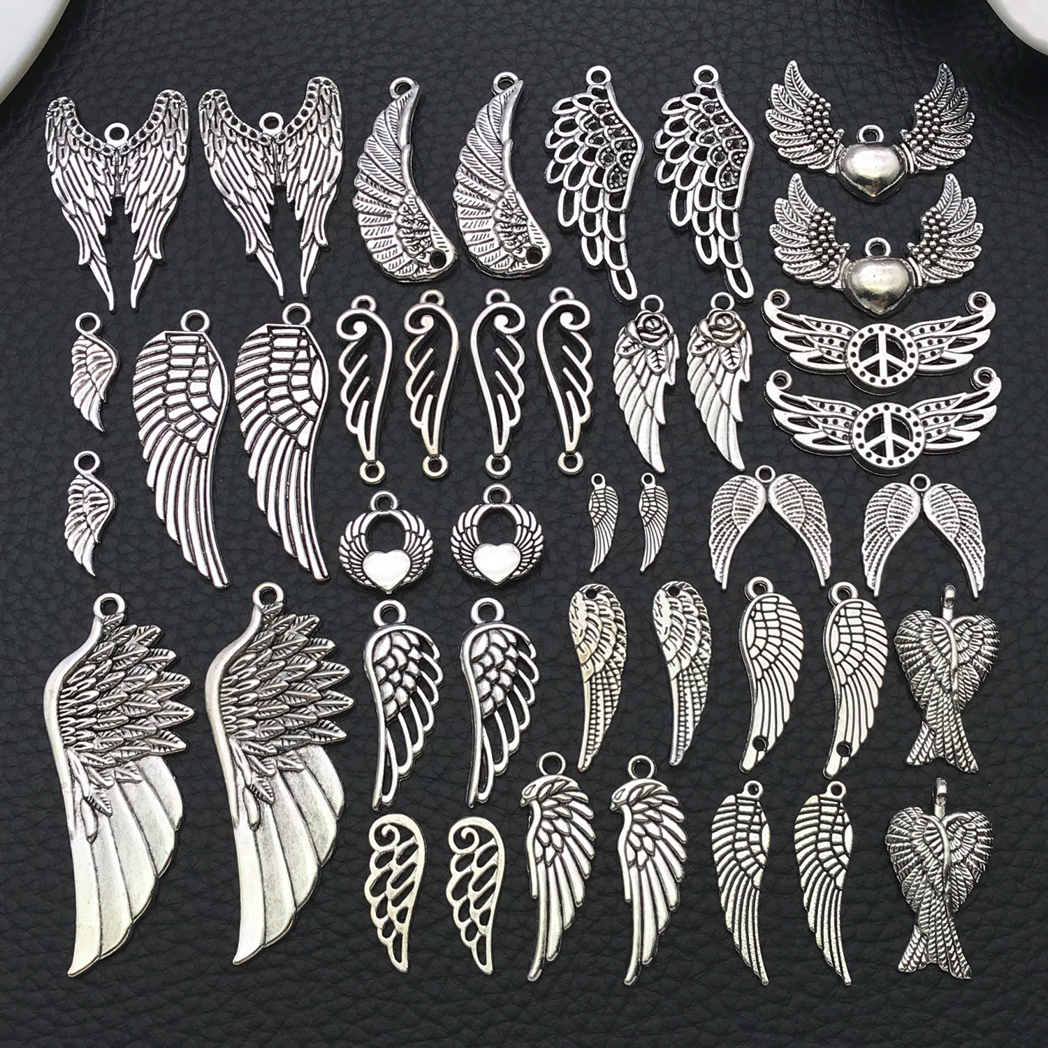 Angel Wing Charms, New 22/42 P - огляд і ціна Vintage Fashion Stores